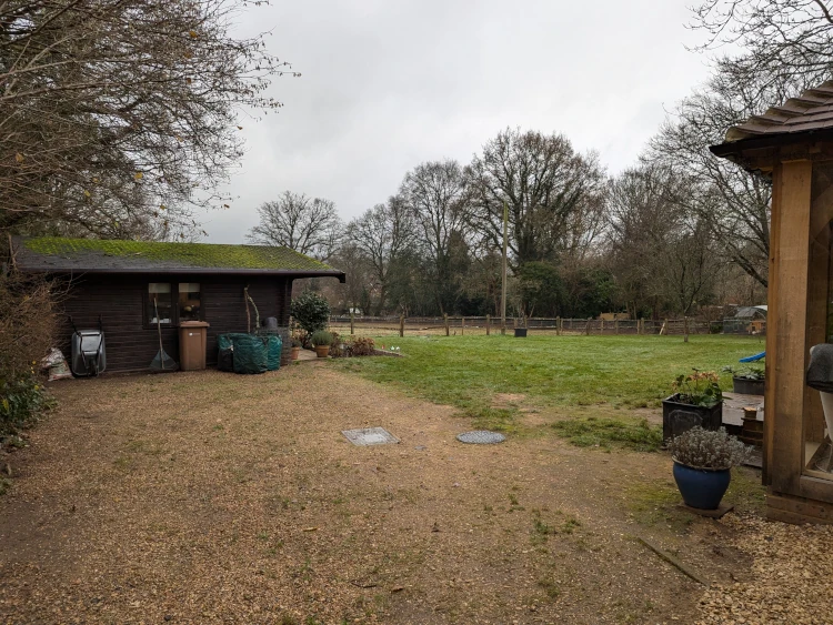 Cottage garden nestled in the sandy heaths of Albury with classic English character