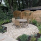 A cottage garden with sandstone terrace and classic English planting