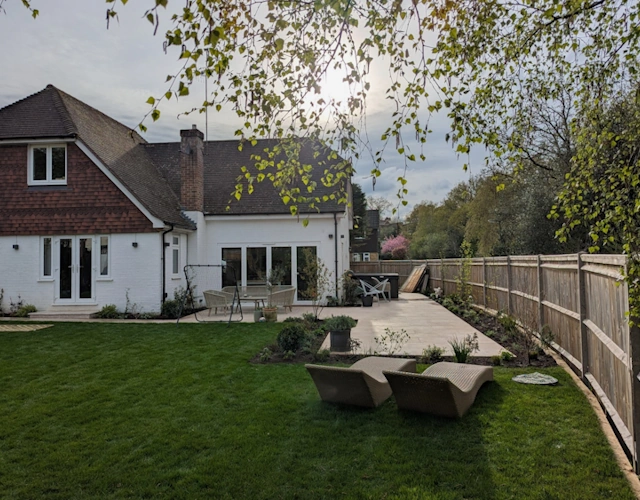 Transformed family garden in Farnham with extended terrace and lawn