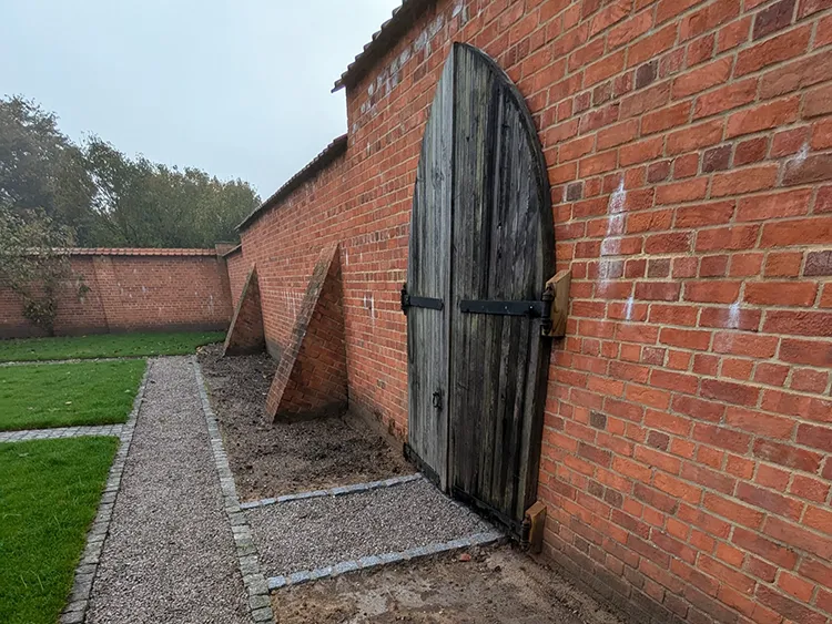 Brick wall with wooden door