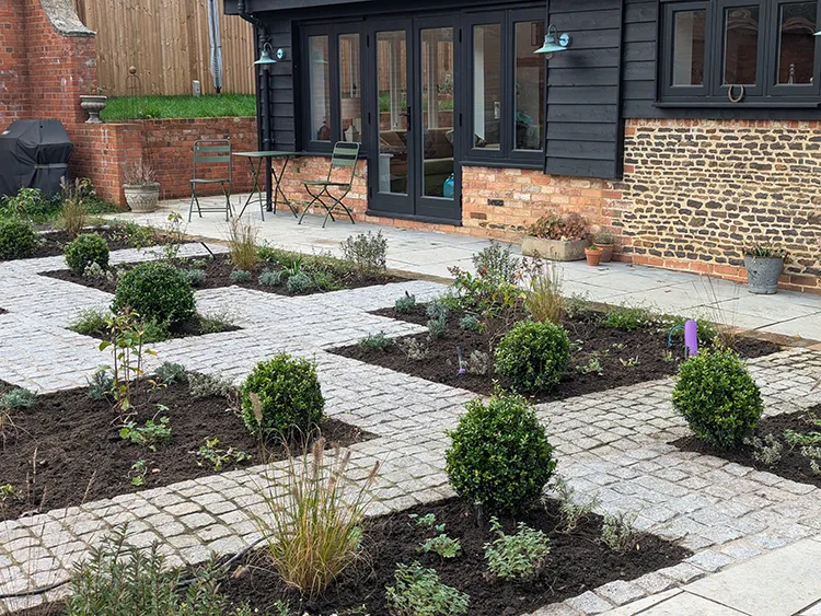 Network of stone paths with some planting between