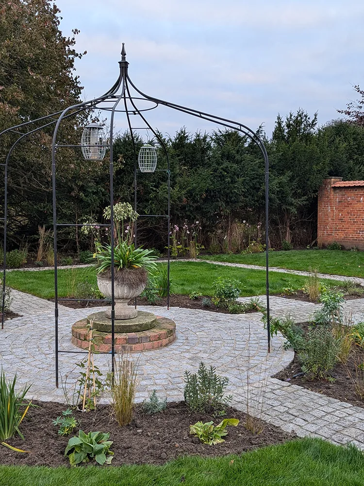 Metal frame over laid stone