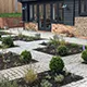 Network of stone pathways with planting between
