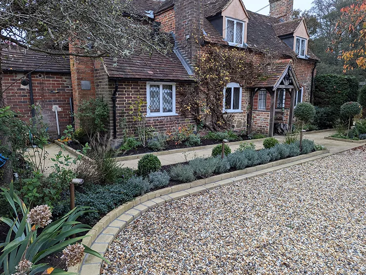 Picture of the front of the house with some planting