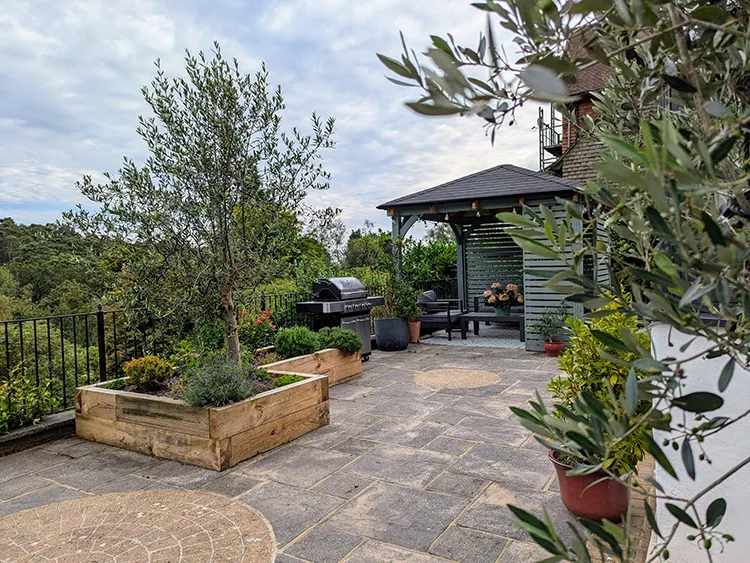 Terrace with bbq and pergola and view to the hills