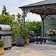 A terrace with bbq and pergola
