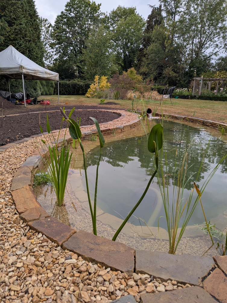 Final view of the finished pond and bog garden ready for planting